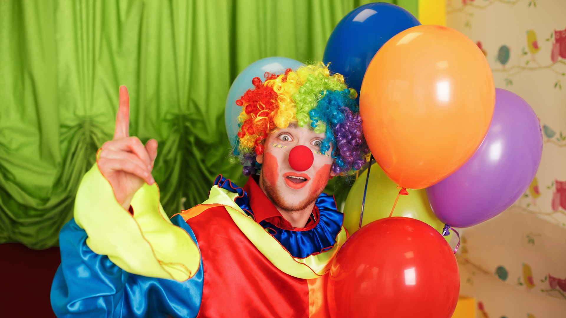 clown holding balloons