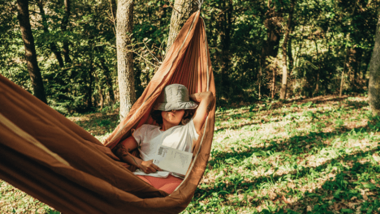 Man relaxing in hammock.