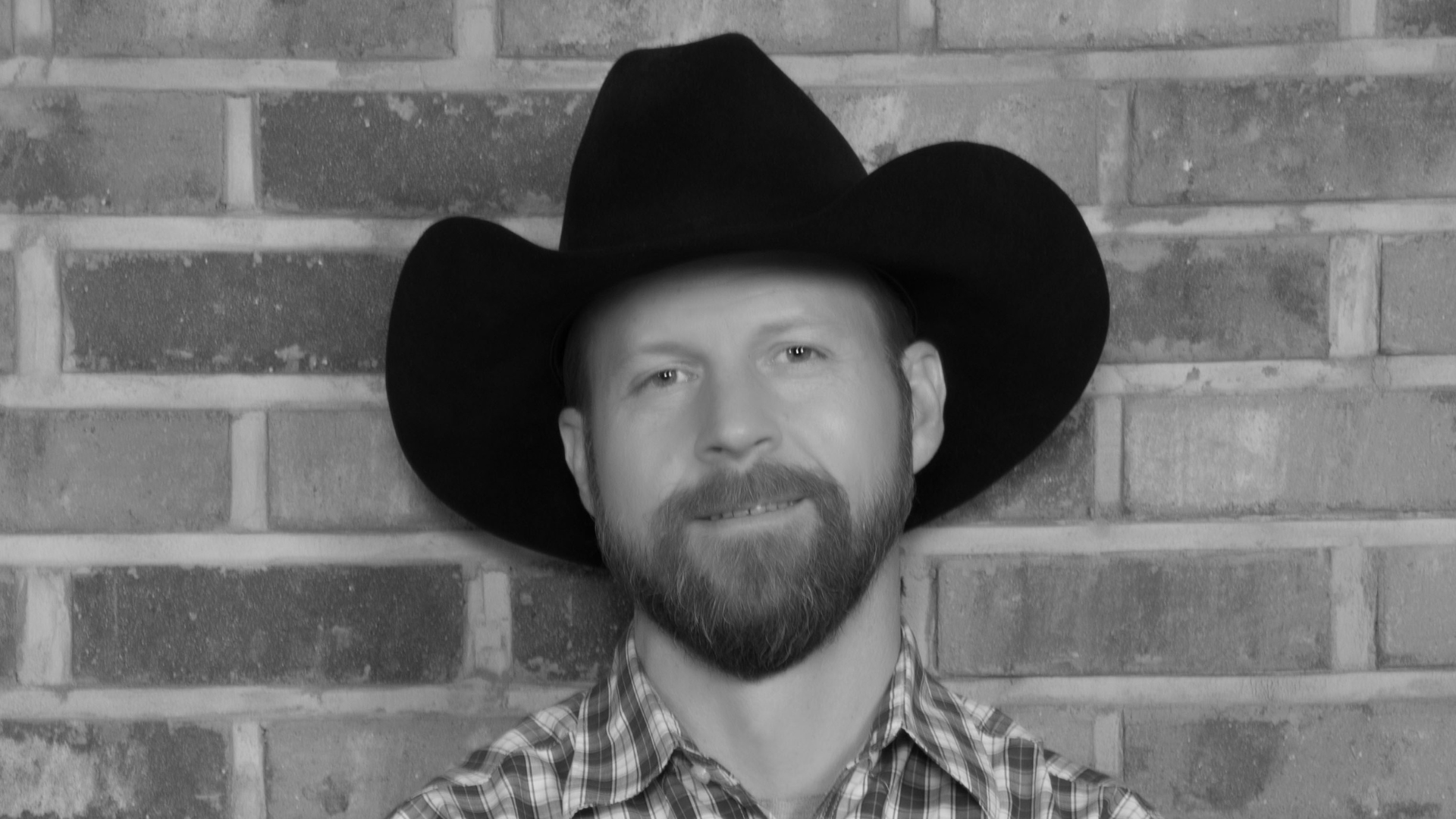 Man in black cowboy hat